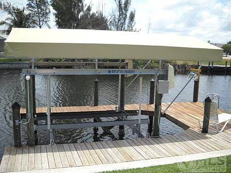 Wrap around dock with 8,000 lb lift and canopy for sun protection for your boat