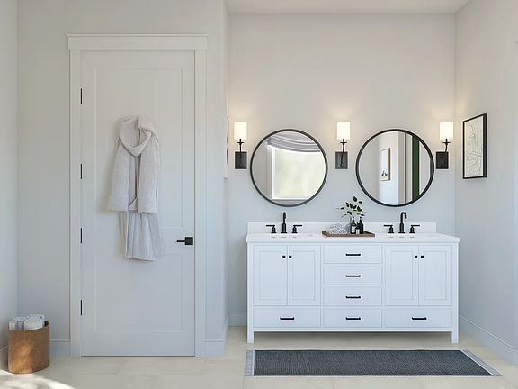 Primary bath featuring freestanding vanity with dual sinks