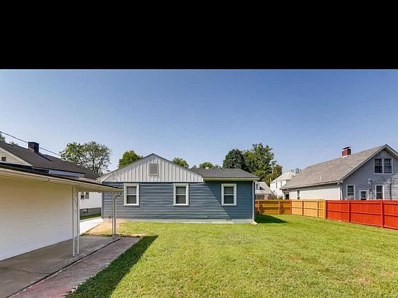 Large back yard with a garage
