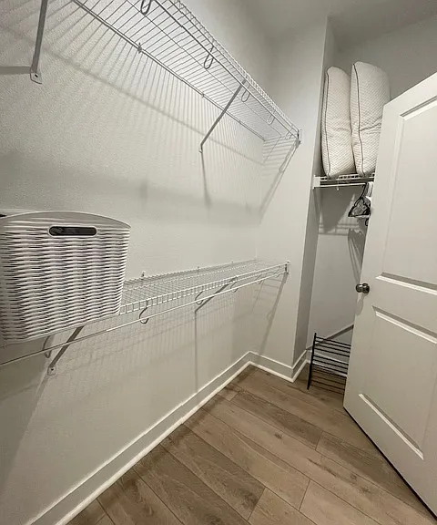 Primary bedroom walk-in closet.