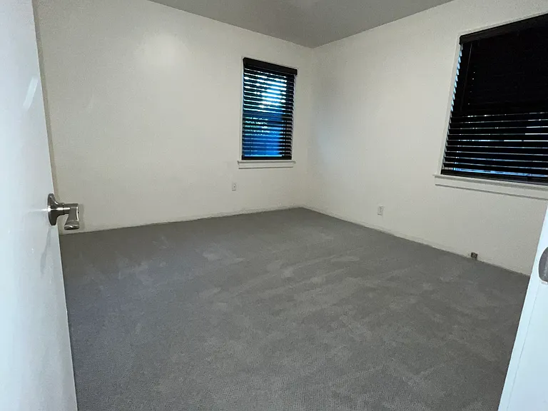 The back bedroom is large with a full closet.
