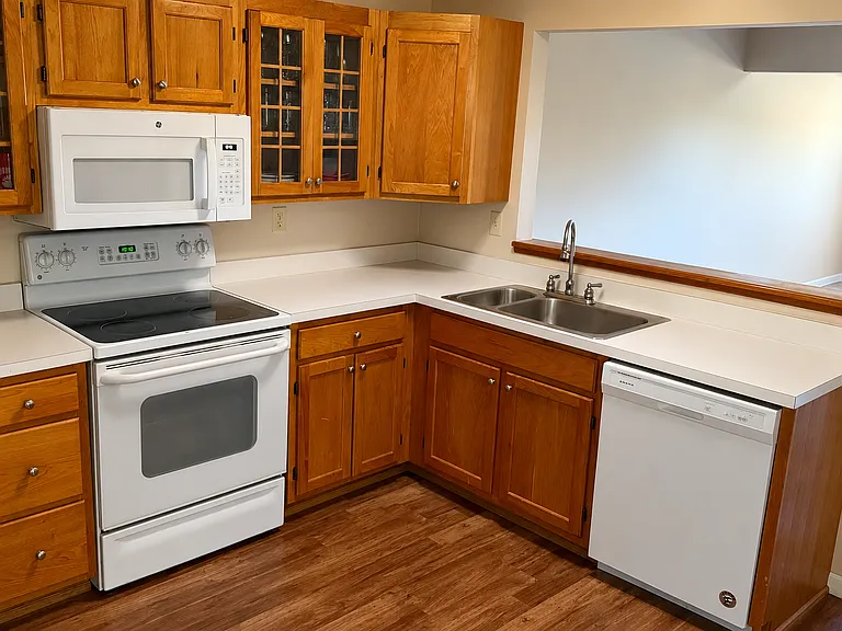 Kitchen with appliances (dishwasher and microwave) both under 2 years old.