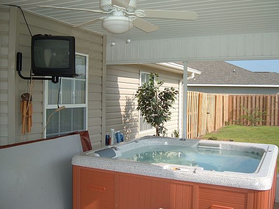 screened in back patio with hottub