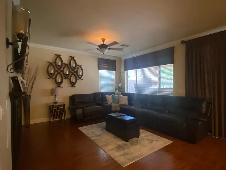 Living room is big enough for an oversized sectional and still has tons of space. Also has amazing views to the pool and patio area.