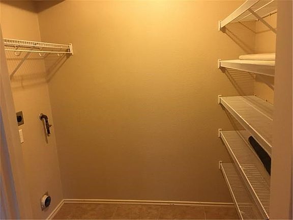 Laundry / pantry room off the living room near the kitchen