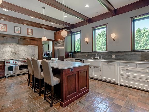 The kitchen is a dream come true for any chef, with pantry storage and top of the line appliances.