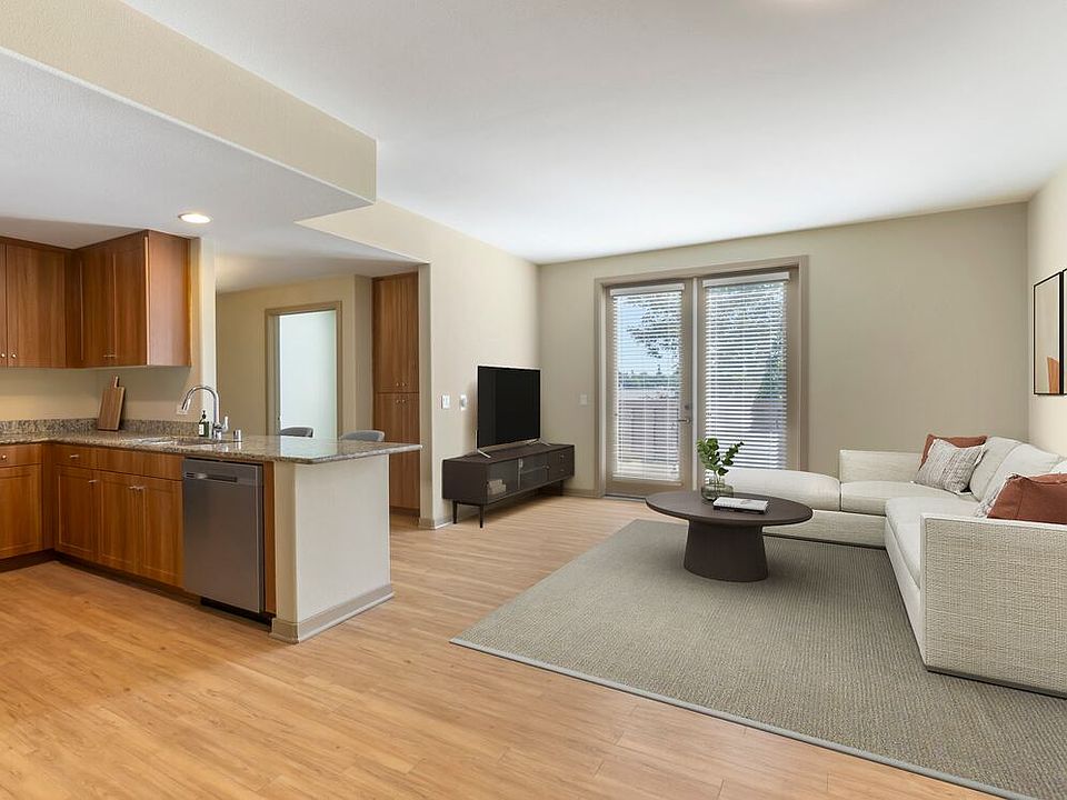 Renovated Package I kitchen and living room with hard surface flooring