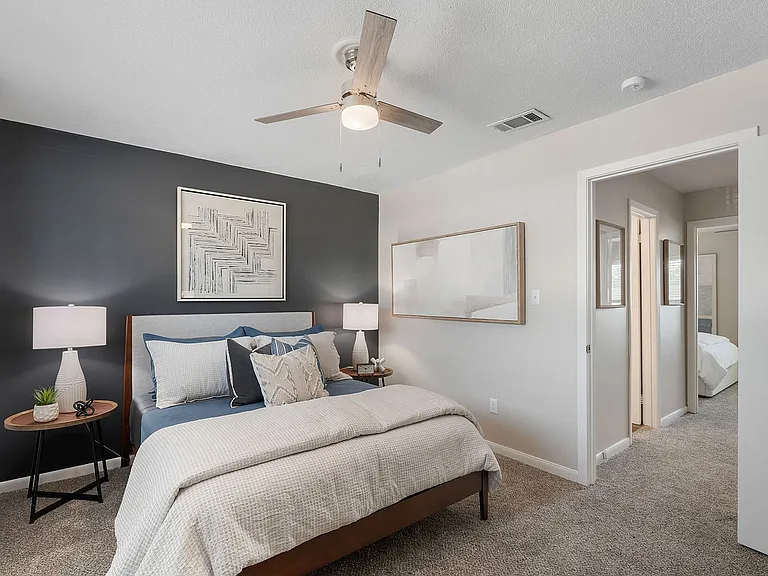 Cozy bedroom with carpet and ceiling fan