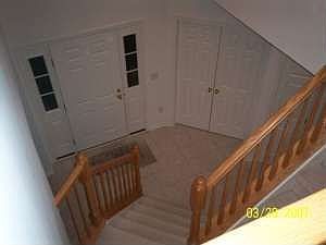 2 story open foyer with ceramic tile