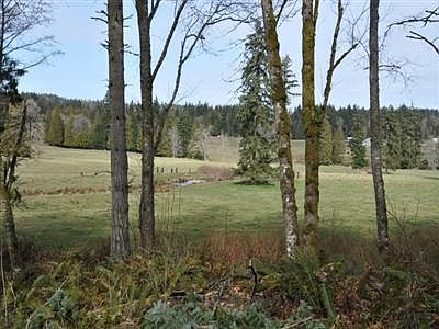 Sit on your country porch and look onto beautiful open fields.