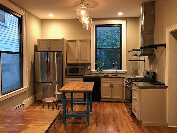 Kitchen view from living room area (note there is no wall separating living room and kitchen