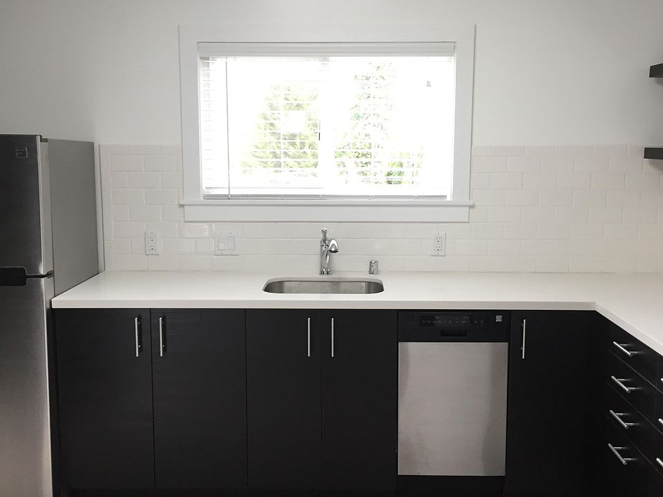 Kitchen, dishwasher, refrigerator. The skylight opens to add fresh air and light.