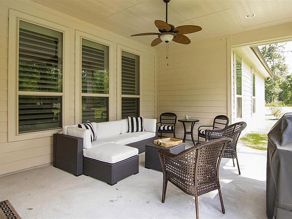 Enjoy your morning coffee on your covered patio just outside the family room with door to the kitchen to gain easy access in and out.