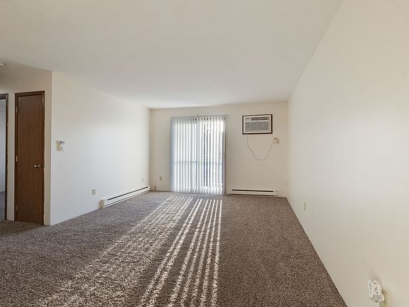 Living Room with Wall Unit Air Conditioning