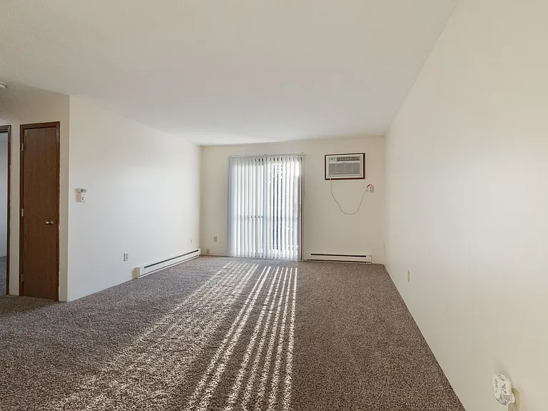 Living Room with Wall Unit Air Conditioning