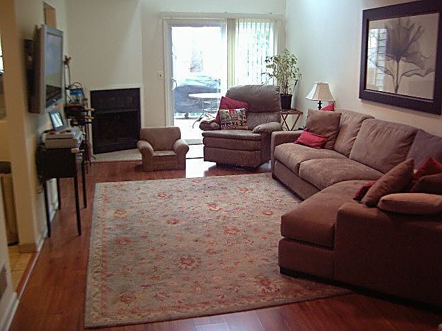 Beautiful Living room with fireplace and new pergo floors