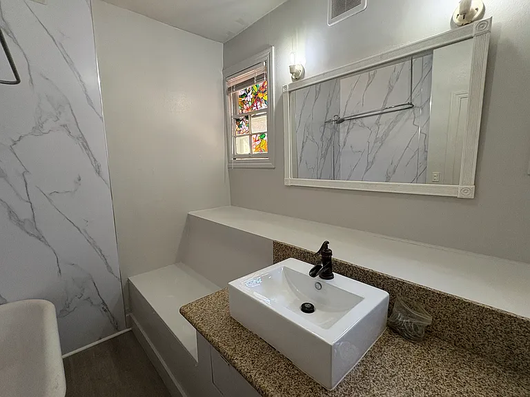 bathroom with new mirror