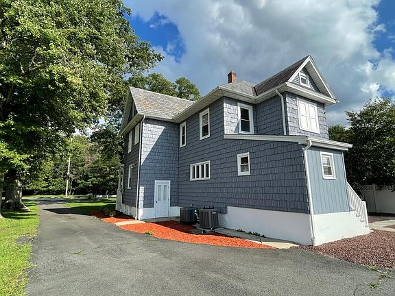 View From back yard looking down driveway out.