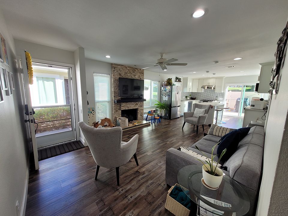 Open concept living and kitchen with upgraded appliances.