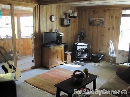 Large living room opens to 3 season porch.