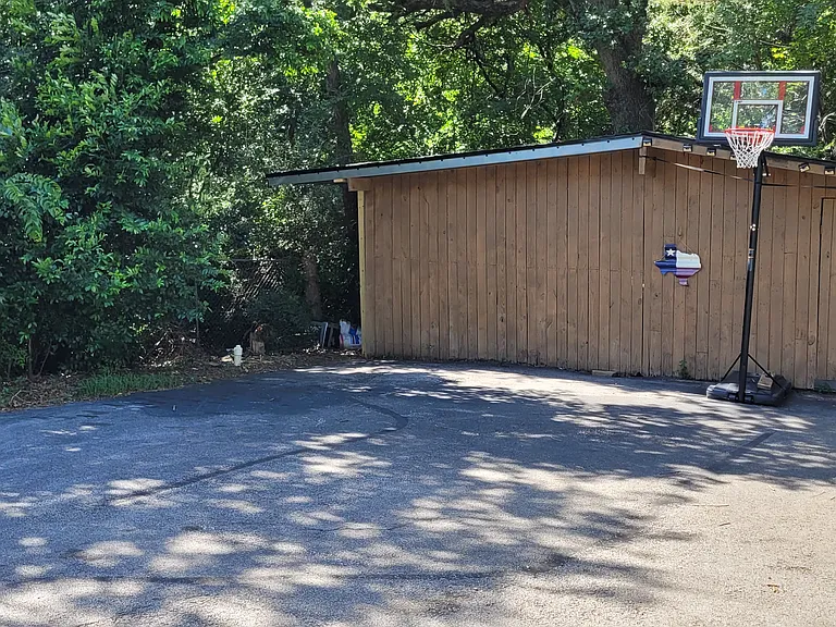 View from front door of apt. Tenant has access to private basketball court. The barn and pens can be made available if tenant desires to keep animals.