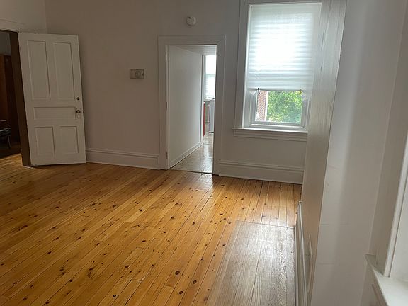 Living room and main entry to landing, potential to share internet. Apt has high ceilings and good light, old yellow pine floors
