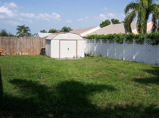 large back yard with shed