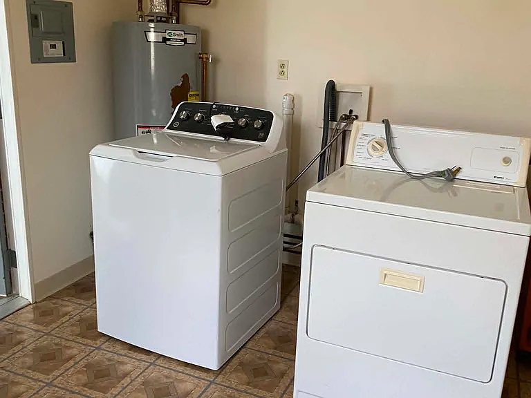 Utility room. New washer and old dryer furnished until no longer repairable, then hook-up only furnished