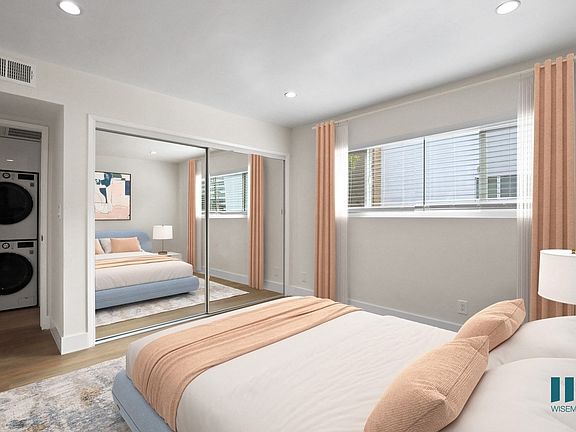 Bedroom with Large-Size Window and Hallway Closet with In-Suite Washer and Dryer
