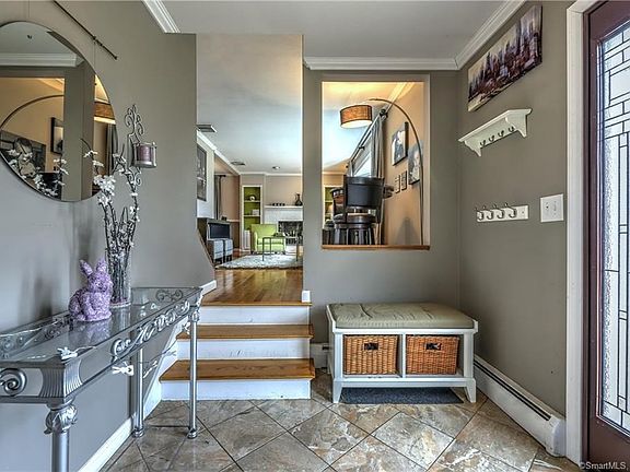 Pretty entry foyer with Italian marble welcomes you!