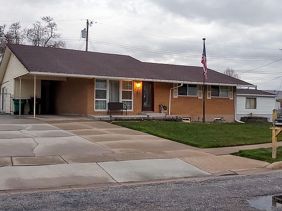 View from the street. Extra wide drive with RV pad.