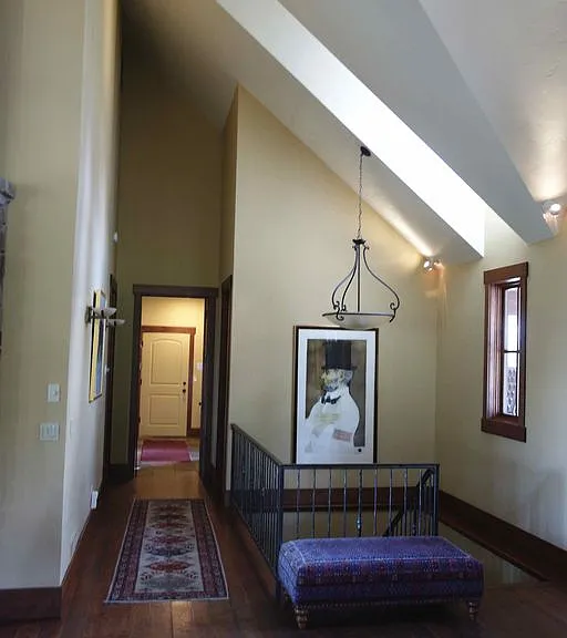 Main level looking to staircase downstairs, and to garage and mudroom
