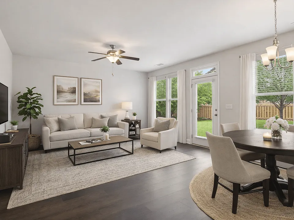 Living room with large window letting in a ton of natural light.