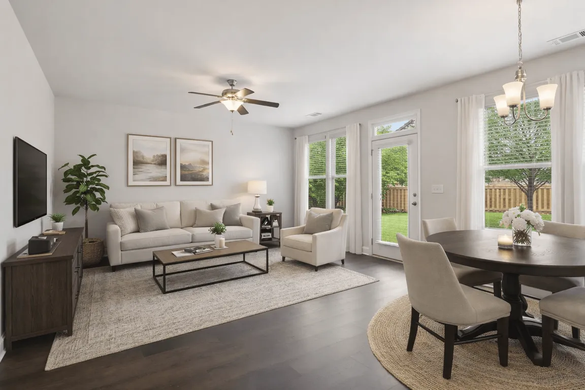 Living room with large window letting in a ton of natural light.