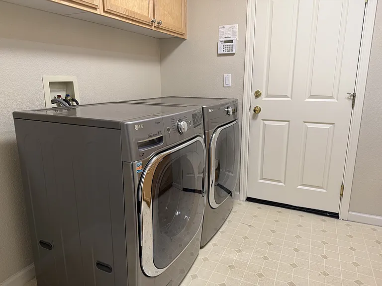 Laundry Room with a sink and storage