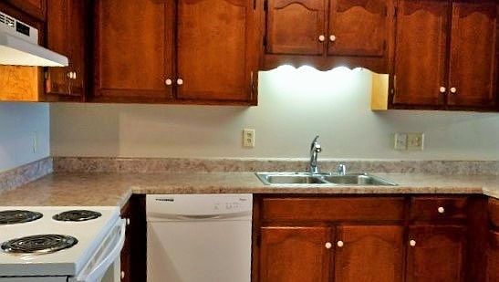 Kitchen with new appliances, ceramic tile floors, and beauti