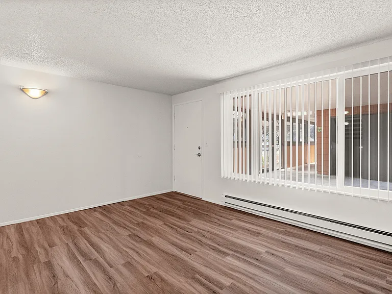 Light-filled Tacoma living room with updated flooring and an open feel. Light-filled Tacoma living room with updated flooring and an open feel.