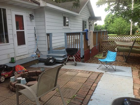 Private brick patio with built in fire pit off master bedroo