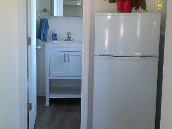 Fridge (larger fridge now there)/bath entry.
