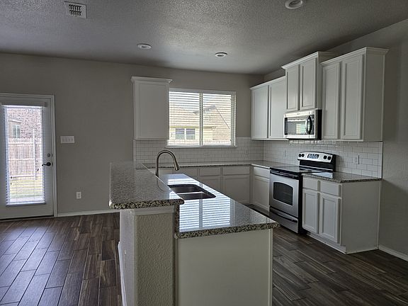 A spacious countertop complemented by ample cabinet storage.