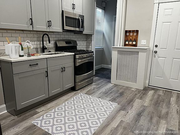 Kitchen with granite counter tops and stainless steel appliances