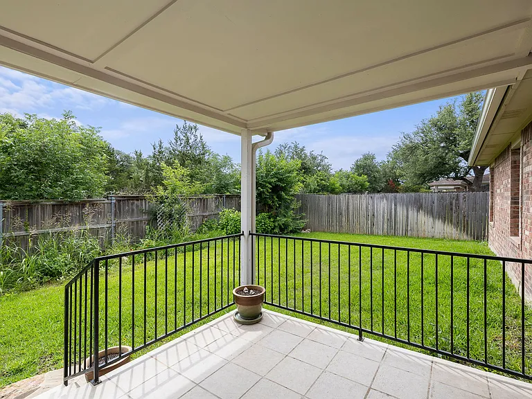 Landscaped back yard, with a covered patio, automatic sprinkler system and facing a green belt!
