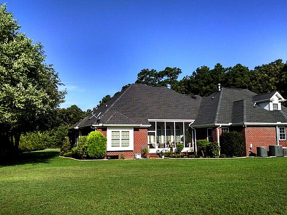 Rear of home w/ Sunroom