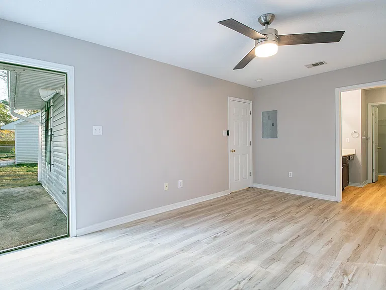 Master bedroom has door to back patio