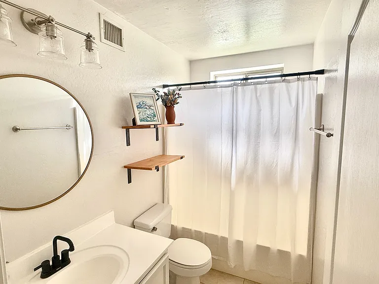 Bathroom downstairs on main level off the kitchen and Queen Bedroom 1