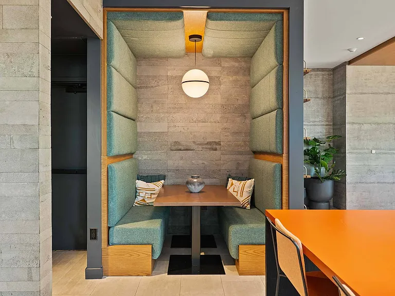 Unwind in a comfortable lounge booth, designed for intimate conversations and comfort.