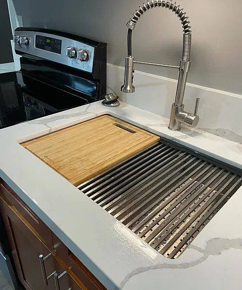 custom sink with cutting board and drying rack