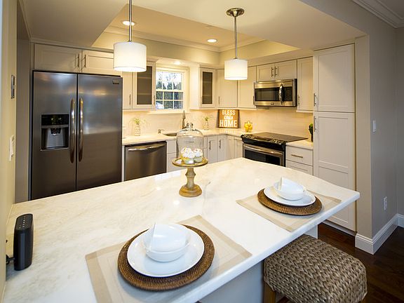 Custom Kitchen : Kitchen features soft close cabinets, marble counters and breakfast nook
