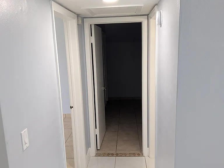 Hallway to bedroom and bathrooms