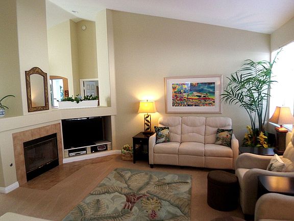 Fireplaced living room with  vaulted ceilings